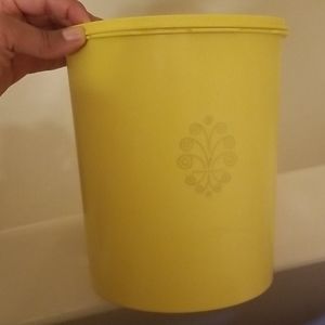 Large yellow Tupperware canister